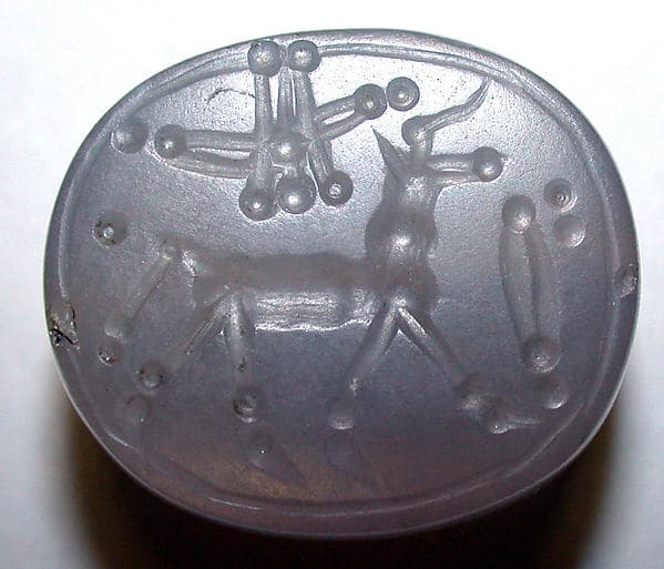 Stamp seal (scaraboid) with animal and divine symbols