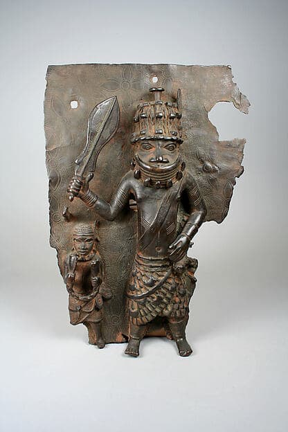 Plaque Fragment with Warrior and Attendant, by Ìgùn Ẹ́rọ̀nwwọ̀n (brass-casting guild) artists