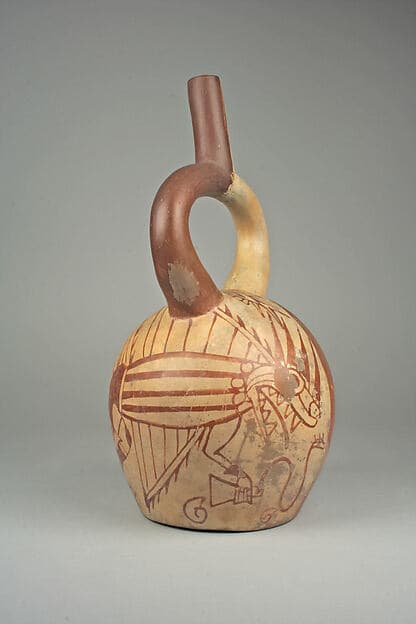 Stirrup spout bottle with fish demon and tumi