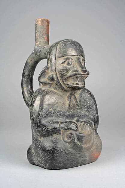 Stirrup Spout Bottle with Seated Figure