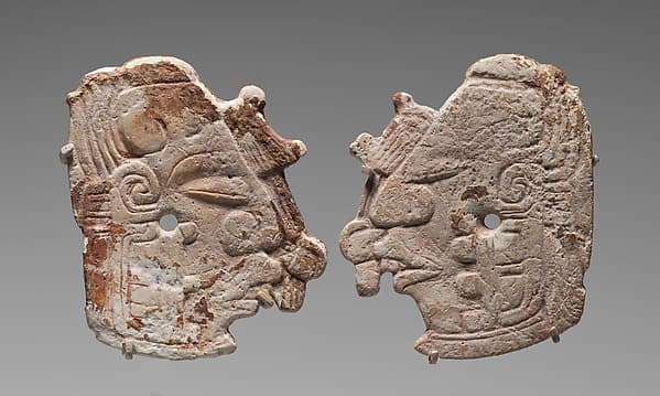 Pair of carved ornaments with the Maize God, by Maya artist(s)