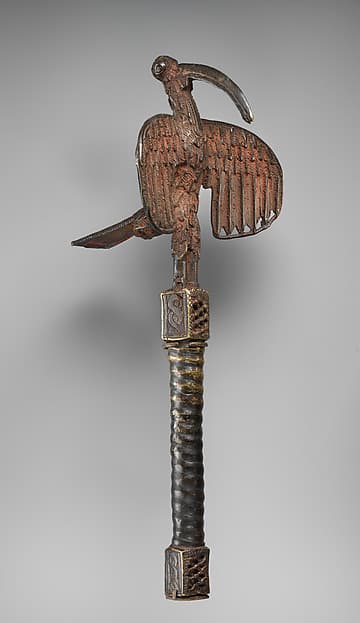 Idiophone with an áhianmwọ́rọ̀ (bird of prophecy), by Ìgùn Ẹ́rọ̀nwwọ̀n (brass-casting guild) artists