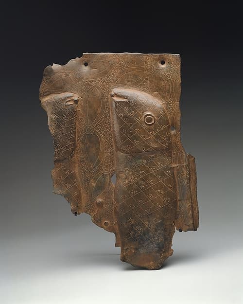 Plaque Fragment with Mudfish, by Ìgùn Ẹ́rọ̀nwwọ̀n (brass-casting guild) artists