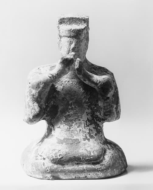 Figure of a seated musician clapping hands
