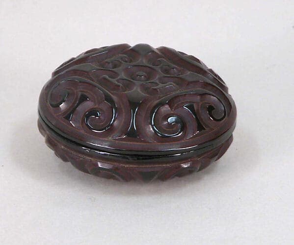 Box with Pommel Scroll Design