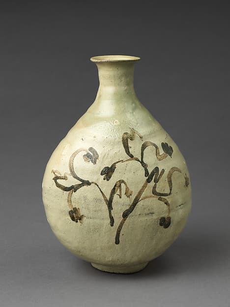 Bottle decorated with flowering plant