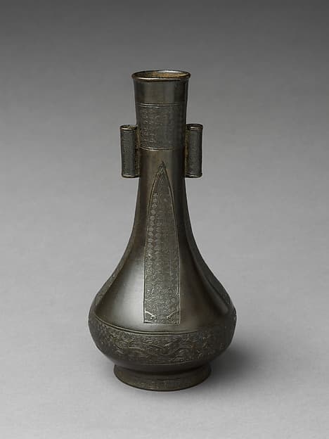 Long neck vase with tubular handles