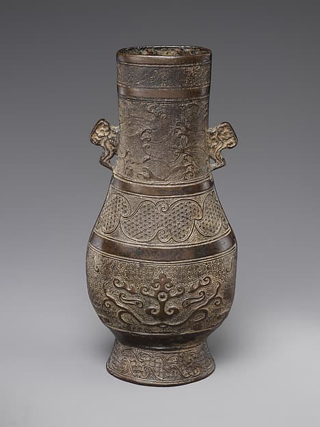 Vase with waves and animal masks