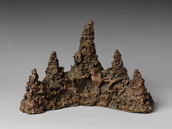 Brush rest in the shape of a mountain
