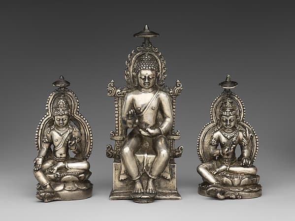 Enthroned Buddha with Avalokiteshvara and Vajrapani