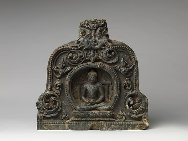 Meditating Buddha with Alms Bowl Enthroned in a Foliated Niche