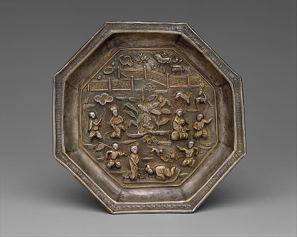 Dish with children playing in a garden