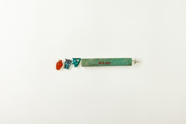 String of 3 amulets and 1 cylindrical bead