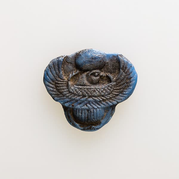 Amulet of winged scarab with falcon head