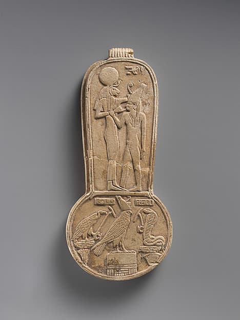 Counterweight of a menit necklace with an image of Bastet nursing King Taharqo