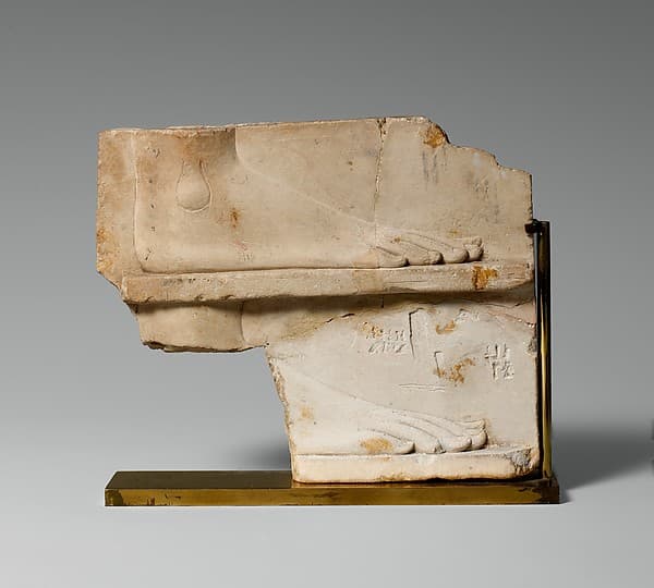 Sculptor's model / votive relief with two sides: side one, two registers with a right foot on each; side two, a royal-like figure
