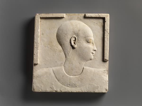 Plaque with head and shoulders of a priestly figure, opposite side head of priestly figure and most of a figure of crocodile-headed god