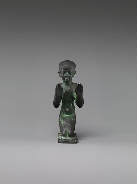 Statuette of an adorant from a group with a god