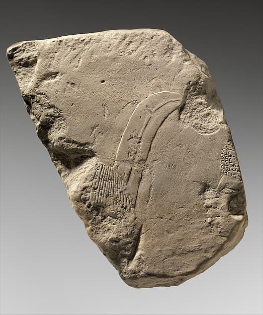 Relief fragment: foreigner with feather in his hair and Nubian