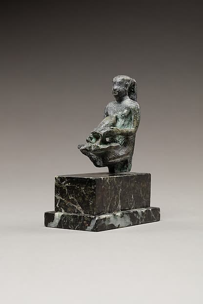Pediese kneeling and pouring libation