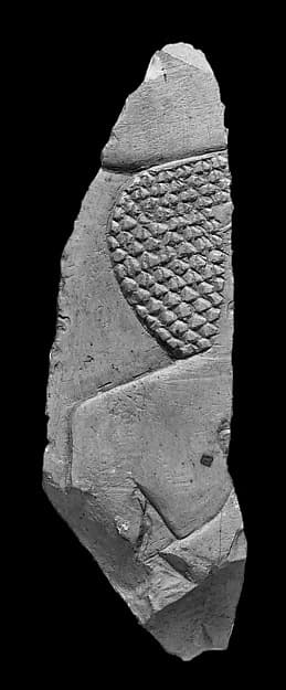 Raised relief fragment with a male offering bearer