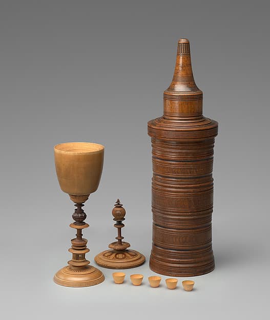 Turned cup and cover with inserts and original case, by Unidentified