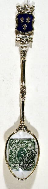 Souvenir spoon with green postage stamp and postmark for Wiesbaden