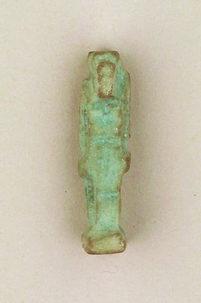 Faience amulet of a ram-headed Amun-re or Khnum