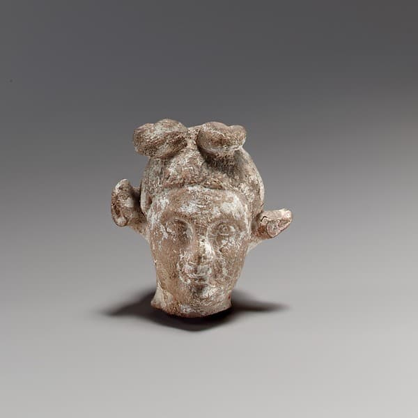 Terracotta head of a youth with a goat headdress