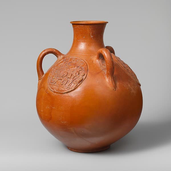 Three-handled jug with relief medallions