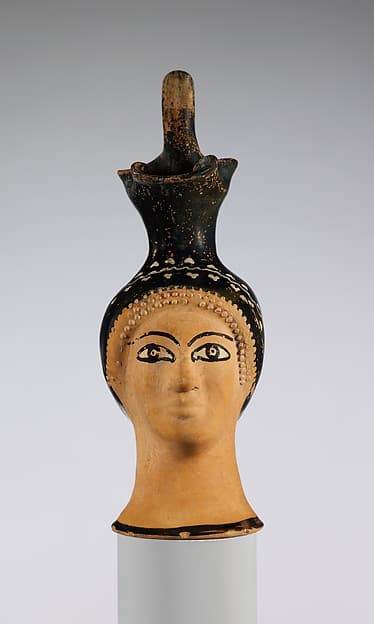 Terracotta oinochoe (jug) in the form of a woman's head, by Class N: The Cook Class of Head Vases