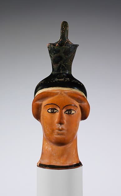Terracotta oinochoe (jug) in the form of a woman's head, by Class S: The Canessa Class of Head Vases