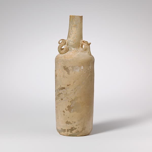 Glass bottle with dolphin handles