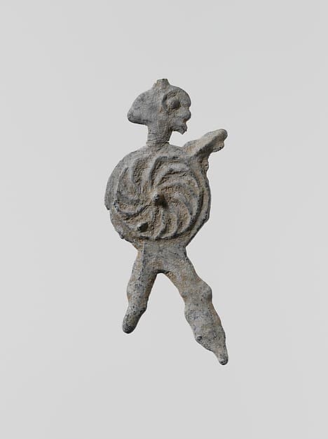 Lead figure of a warrior with a spear and shield