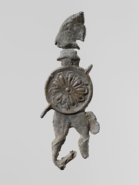 Lead figure of a warrior with a helmet and shield