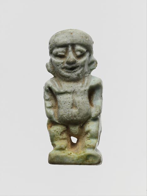 Faience two-sided amulet in the form of the dwarf god Pataikos