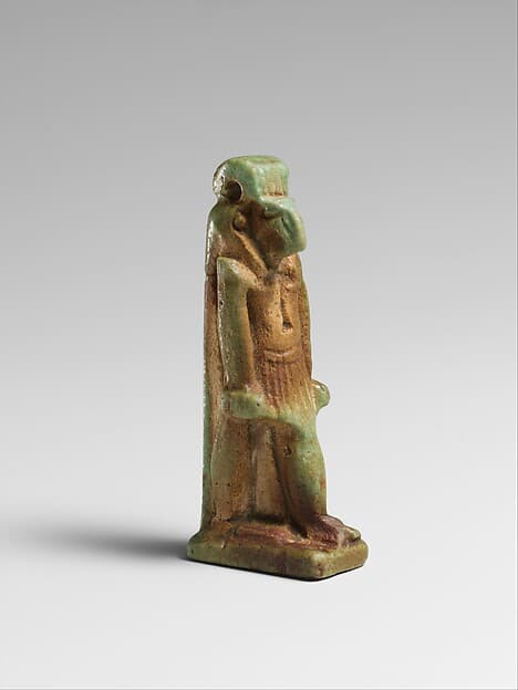Faience amulet of a ram-headed Amun-re or Khnum