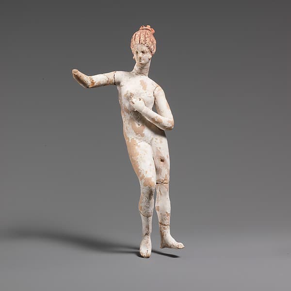 Terracotta statuette of a nude woman