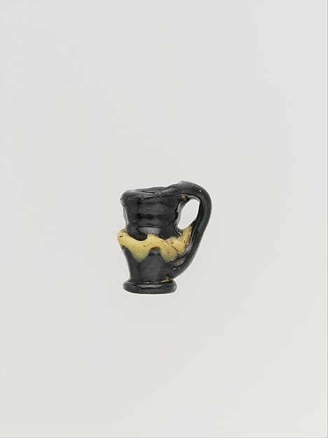 Glass pendant shaped like a jug