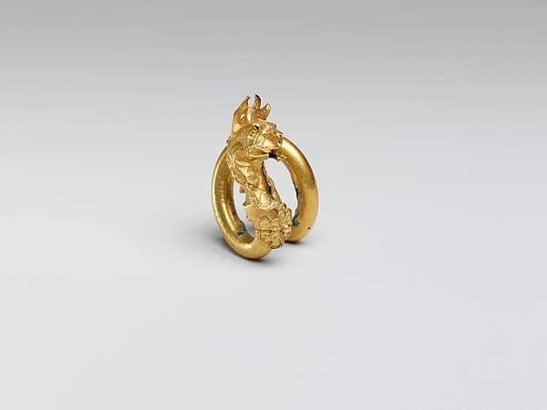 Gilt bronze spiral with griffin terminal
