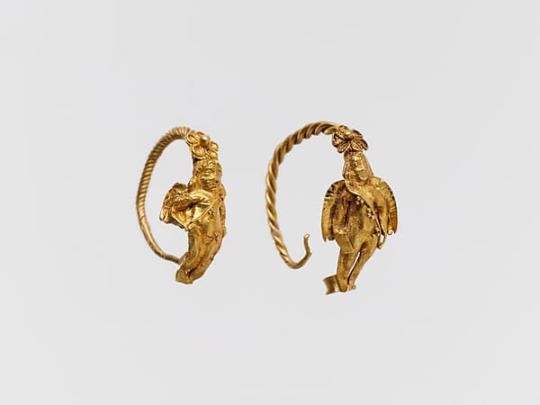 Gold earring with winged figure
