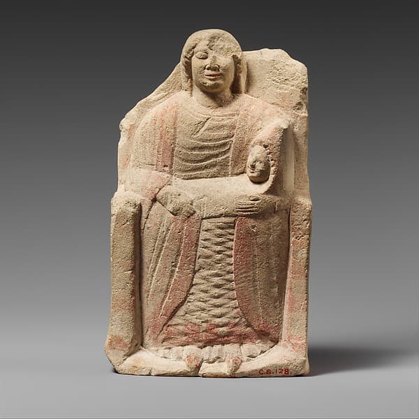 Seated limestone kourotrophos