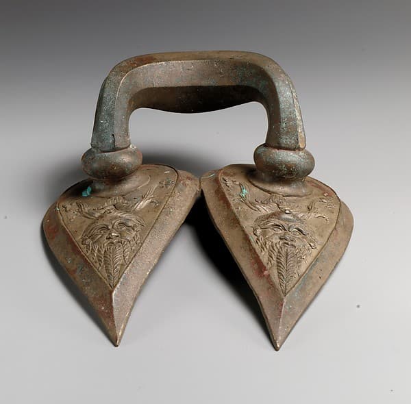 Bronze handle of a vessel with Silenos mask