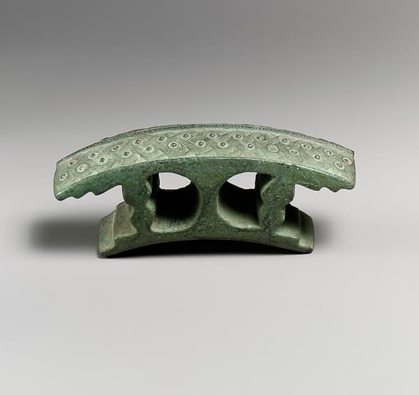 Bronze attachment with silver studs