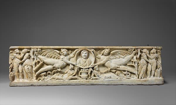 Marble sarcophagus with flying erotes holding a clipeus portrait