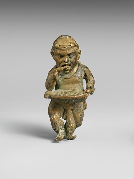 Bronze statuette of a dwarf with silver eyes