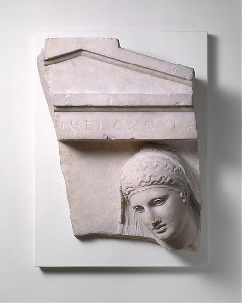 Fragment of a marble grave stele of a woman