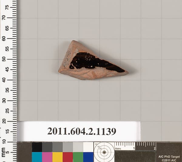 Terracotta fragment of a lekanis lid (covered dish)