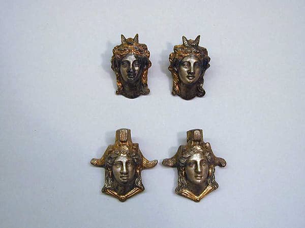 Four silver-gilt attachments