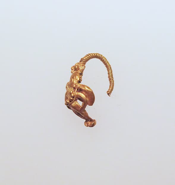 Gold earring with winged figure
